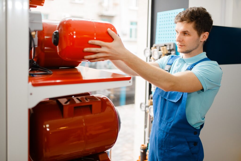Plumber choosing expansion tank for water pump